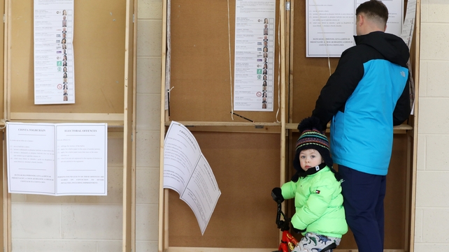 Harry Cooney, 3, and Declan Cooney at the polling booth at the polling station at St Joseph's School for Deaf Boys in Cabra