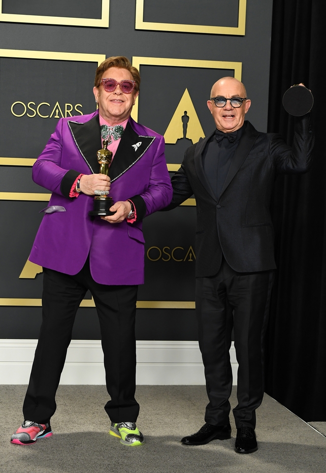Musician Elton John and lyricist Bernie Taupin, winners of the Original Song award for (I'm Gonna) Love Me Again Rocketman