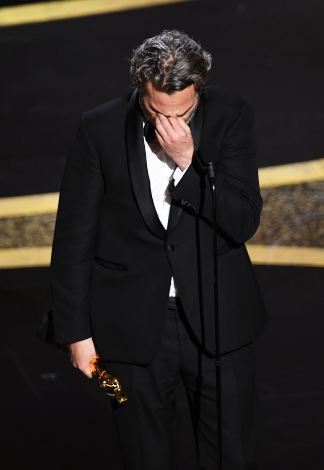 Joaquin Phoenix accepts the Actor In A Leading Role award for Joker