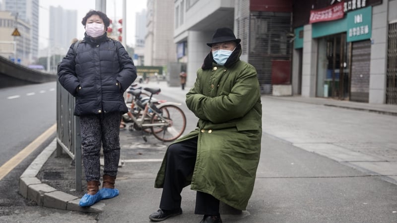Two residents wear protective masks in Wuhan shortly after the outbreak began