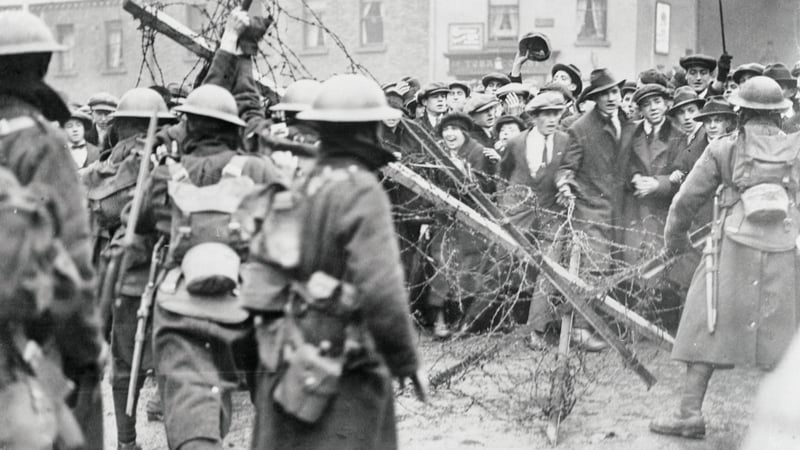 A crowd confronts British soldiers in Dublin in April 1920. Photo: Getty Images