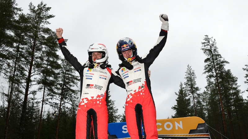 Elfyn Evans (R) celebrates with his co-driver Scott Martin