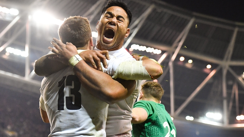 Manu Tuilagi embraces Henry Slade during England's Six Nations victory Dublin last year