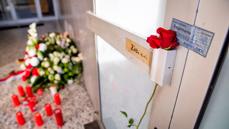 A rose is seen on the door handle at the entrance to Arena Bar and Kiosk for the victims of the Hanau shooting