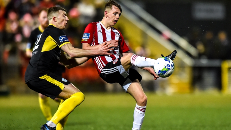Ciaron Harkin of Derry City in action against Sam Todd of Finn Harps