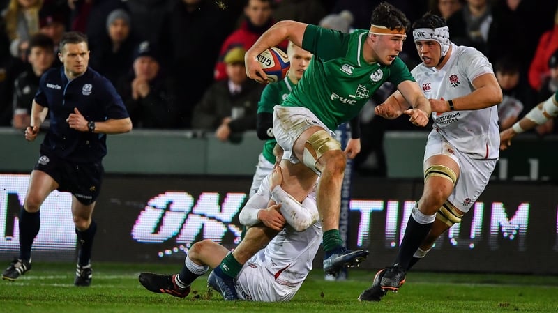 David McCann of Ireland is tackled by George Barton of England