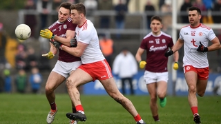 Cillian McDaid of Galway is tackled by Brian Kennedy of Tyrone