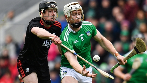 Robert Downey of Cork attempts to tackle Limerick's Cian Lynch