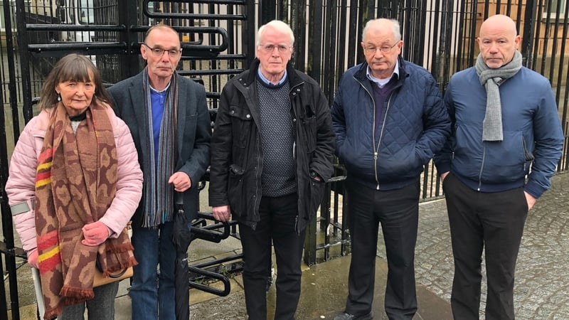 The siblings of Bloody Sunday victim James Wray, Margaret and Liam; brother of victim Michael Kelly, John; and brothers of victim William McKinney, Mickey and John outside Derry Magistrates' Court