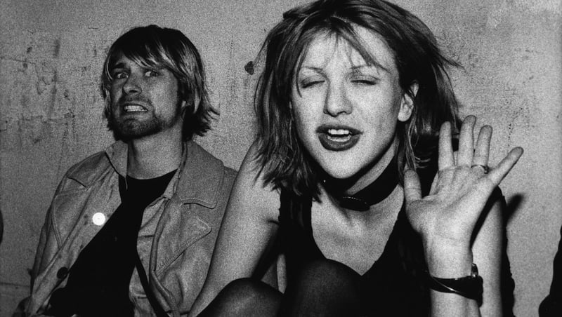 Kurt Cobain and Courtney Love pose on the VIP balcony during a Mudhoney concert at the Hollywood Palladium on December 4, 1992 in Los Angeles