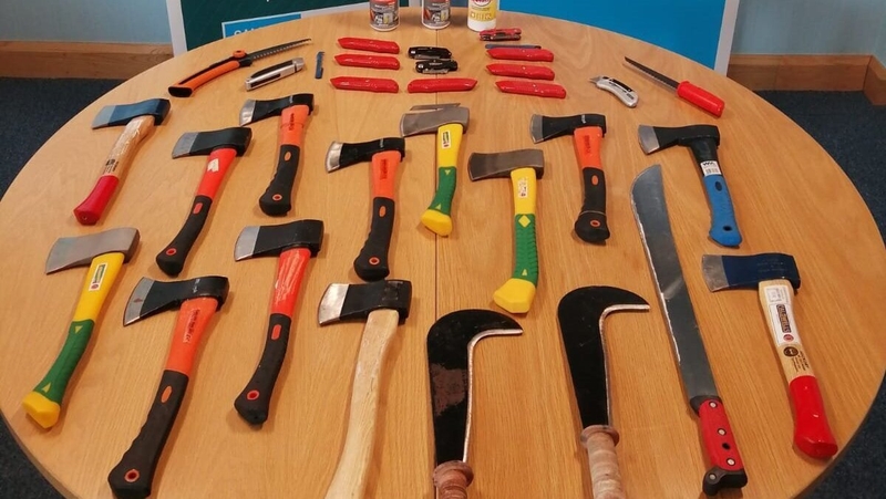 A machete and hatchets were among the weapons seized (Photo: PSNI)