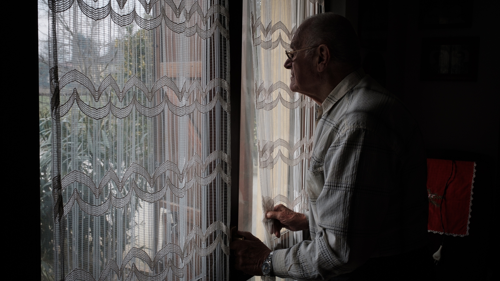 Marzio's grandfather looks out at an empty street