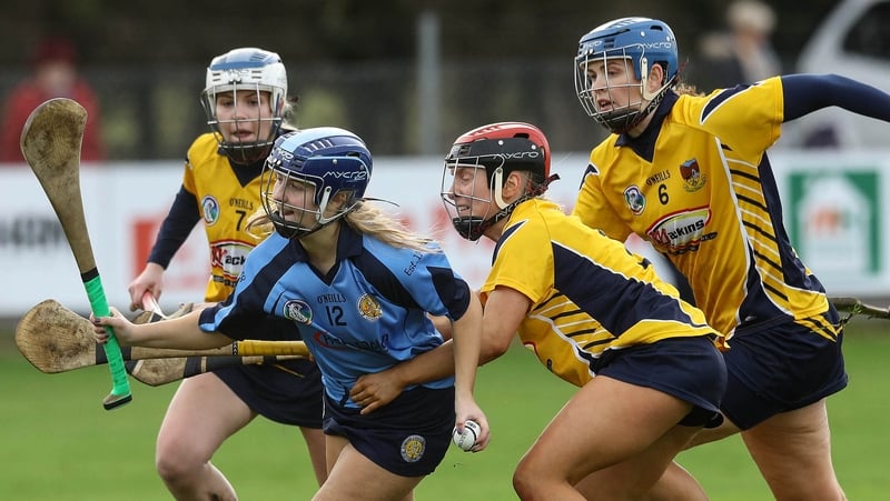 Gailltír's Annie Fitzgerald (in blue) takes on the Clonduff defence