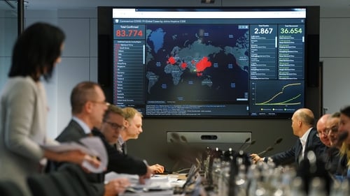 Members of Germany's emergency task force sit down for a coronavirus briefing