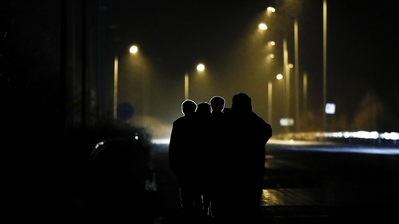 Refugees walk on a road near the Greek-Turkey border crossing of Kastanies