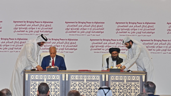 US Special Representative for Afghanistan Reconciliation Zalmay Khalilzad and Taliban co-founder Mullah Abdul Ghani Baradar sign peace agreement
