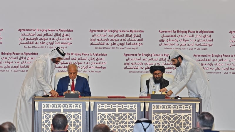 US Special Representative for Afghanistan Reconciliation Zalmay Khalilzad and Taliban co-founder Mullah Abdul Ghani Baradar sign peace agreement