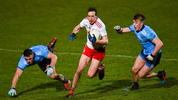 Colm Cavanagh of Tyrone in action against Dublin's Brian Howard (L) and Seán Bugler.