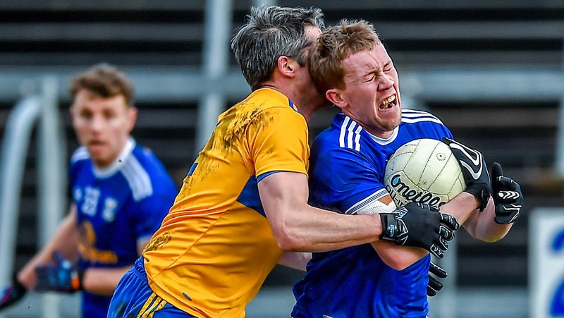 Chris Conroy of Cavan battles with Clare's Jack Browne