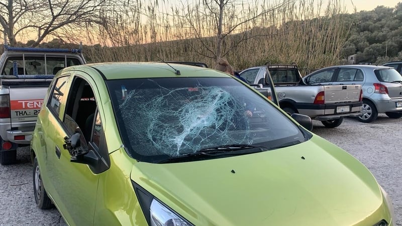 One of the five rental cars that were attacked by groups with planks of wood