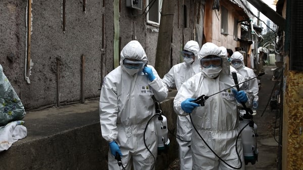 South Korean soldiers spray antiseptic solution against the coronavirus in Guryong, Seoul