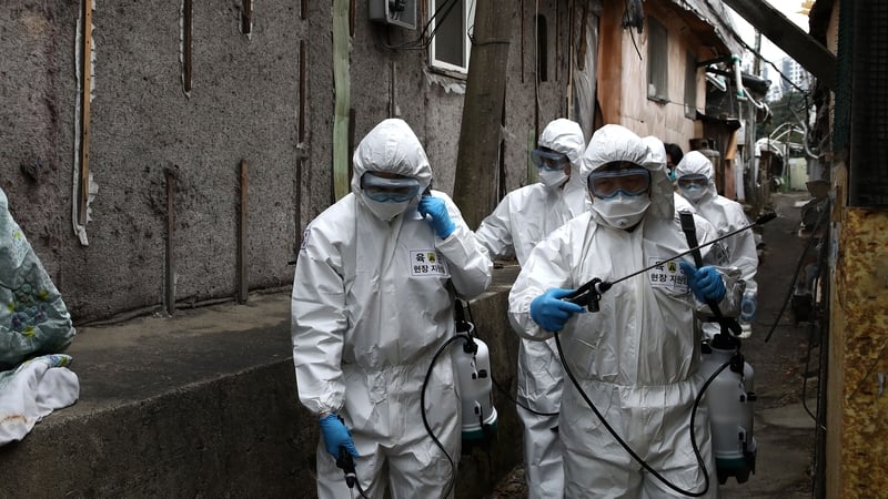 South Korean soldiers spray antiseptic solution against the coronavirus in Guryong, Seoul