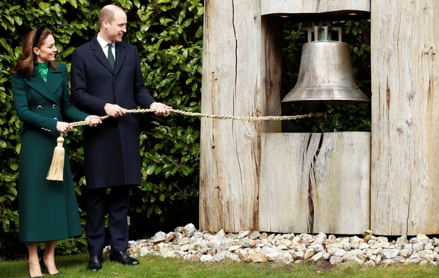 Facing the music: The couple ring the 'peace bell' at Áras an Uachtaráin
