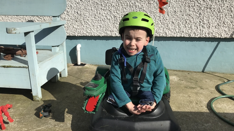 James Smyth uses the dino-cart around the family garden near Raphoe