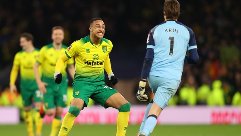 Adam Idah (L) celebrates with Norwich goalkeeper Tim Krul