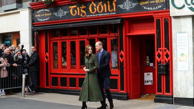 The royal couple leave the pub to greet the crowd outside