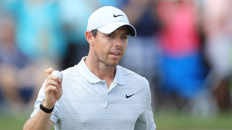 Rory McIlroy reacts after finishing on the ninth green