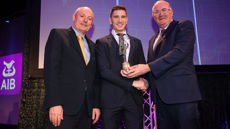 Brendan Maher (c) receiving his award