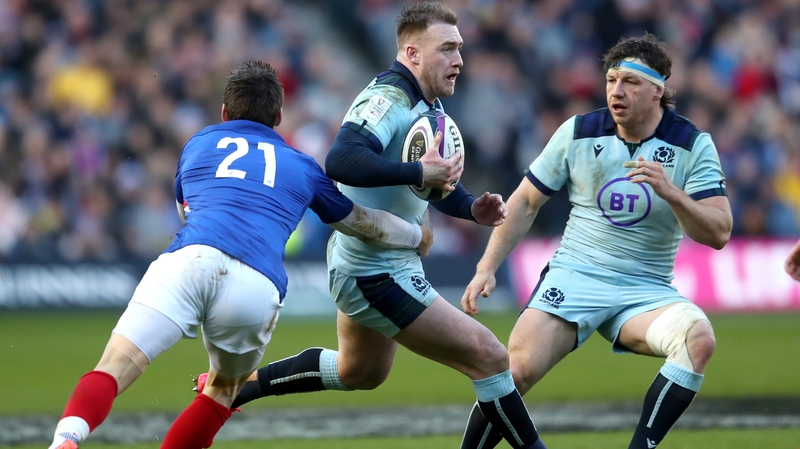 Stuart Hogg darts past Baptiste Serin at Murrayfield