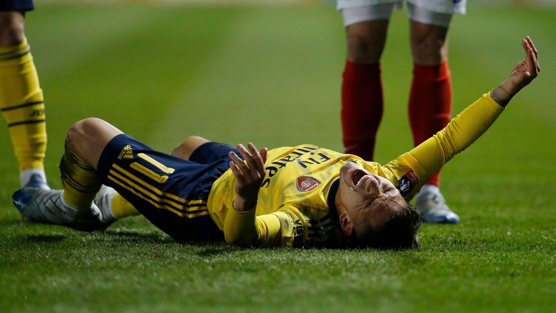 Lucas Torreira reacts after picking up the injury