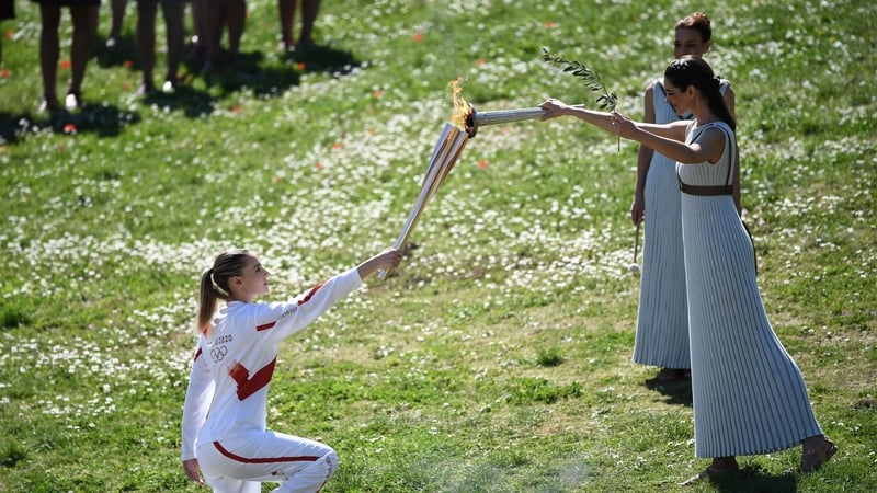 Torchbearer Anna Korakaki from Greece receives the Olympic at ancient Olympia