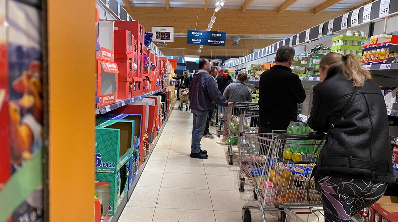 Shoppers queue in Lidl in Swords, Dublin