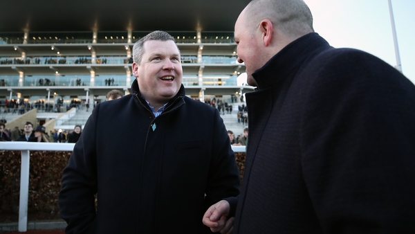 Trainer Gordon Elliott (L) celebrates after Milan Native wins the Fulke Walwyn Kim Muir Challenge Cup Amateur Riders' Handicap Chase