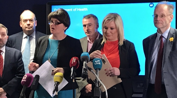 Arlene Foster made no attempt to hide her disapproval as Michelle O'Neill said schools should be closed