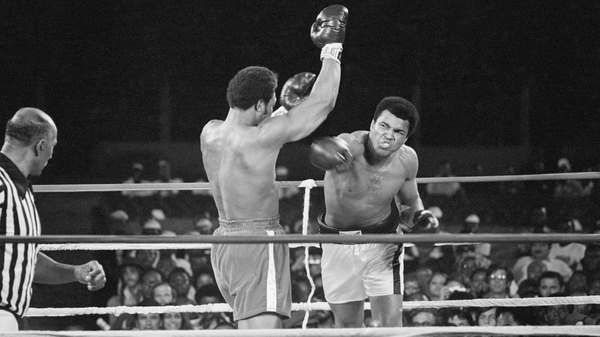 Muhammad Ali fires a right at George Foreman during the Rumble in the Jungle in Kinshasa in 1974