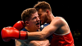 Michael Nevin (L) defeated Max Van Der Pas of the Netherlands in their middleweight 75KG Preliminary round bout