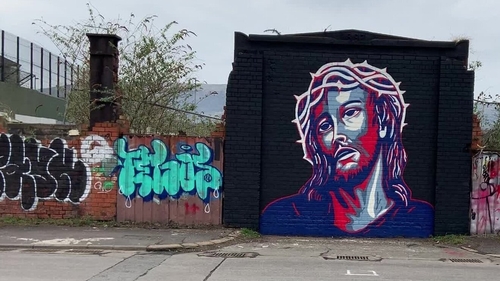 Glen Molloy's mural is located between the Falls Road and the Shankill Road
