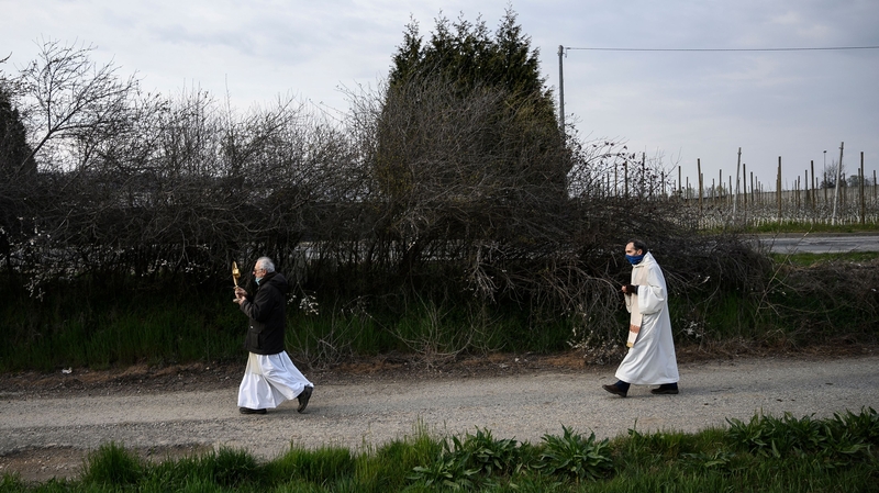 Priests in Italy conduct a countryside procession to bless houses against the coronavirus pandemic