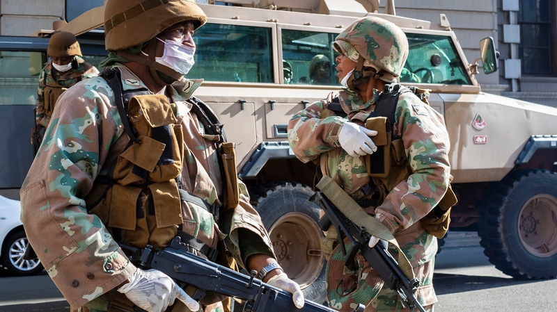 Members of the South African National Defence Force patrol a street in Johannesburg, South Africa, the continent's worst-affected country