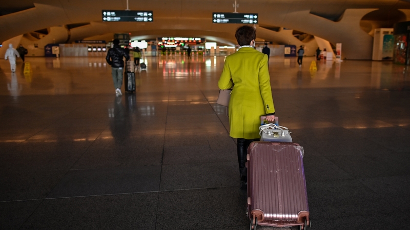 Passengers at the main rail station in Wuhan