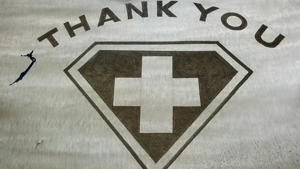 A super salute in the sand to frontline health workers