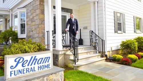 Clive Anderson on the steps of Pelham Funeral Home in Westchester County