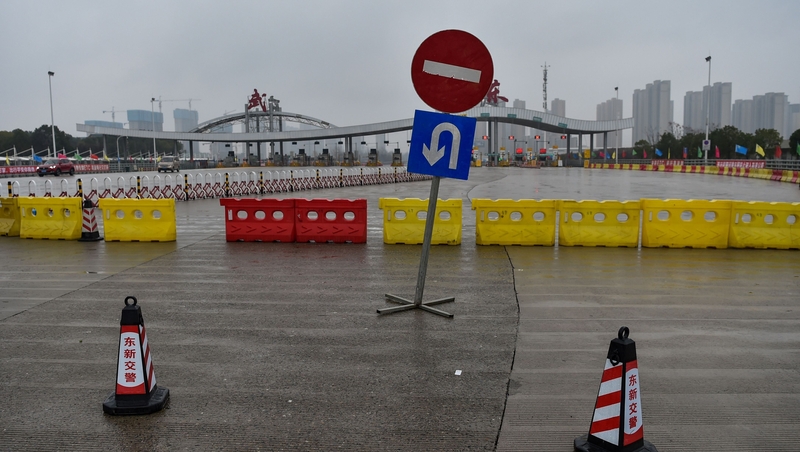 Chinese police blocked roads out of Wuhan as part of the lockdown