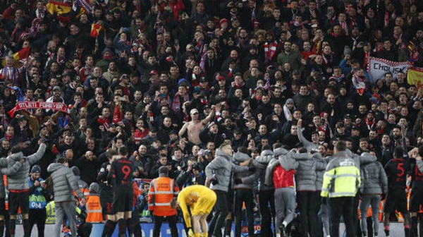 Atletico fans in the Anfield stands celebrate the win over Liverpool