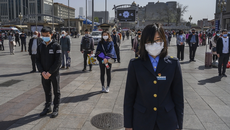 Citizens paused in memory of the more than 3,000 lives claimed by the virus in China