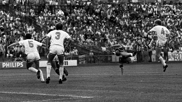 Ronnie Whelan in acrobatic pose when scoring against the USSR in Hanover